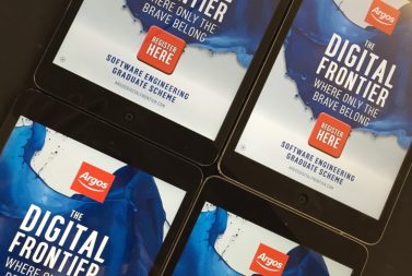 Tablets with promotional posters for Argos